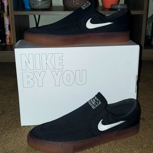 Black slip-on, Stefan Janoski, sneakers. Never worn and still in original box.